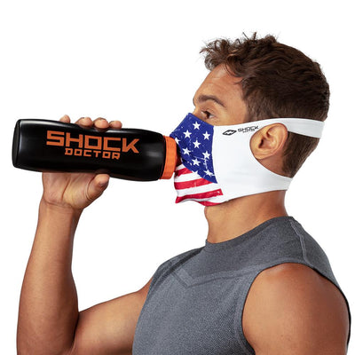 USA Stars & Stripes Play Safe Face Mask – Male Model Wearing Protective Safety Face Mask while Drinking a Hydration Water Bottle - Left Angle